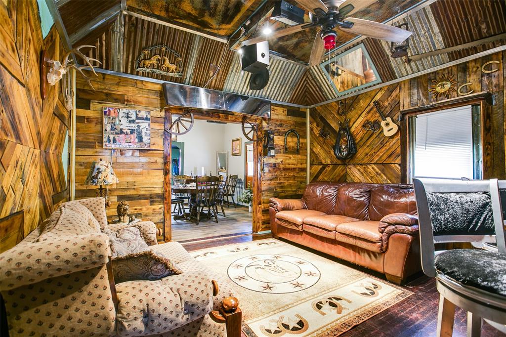 1303 North 7th Street Ballinger, TX 76821 - Photo 9 of 26 a outdoor living area with furniture and a rug