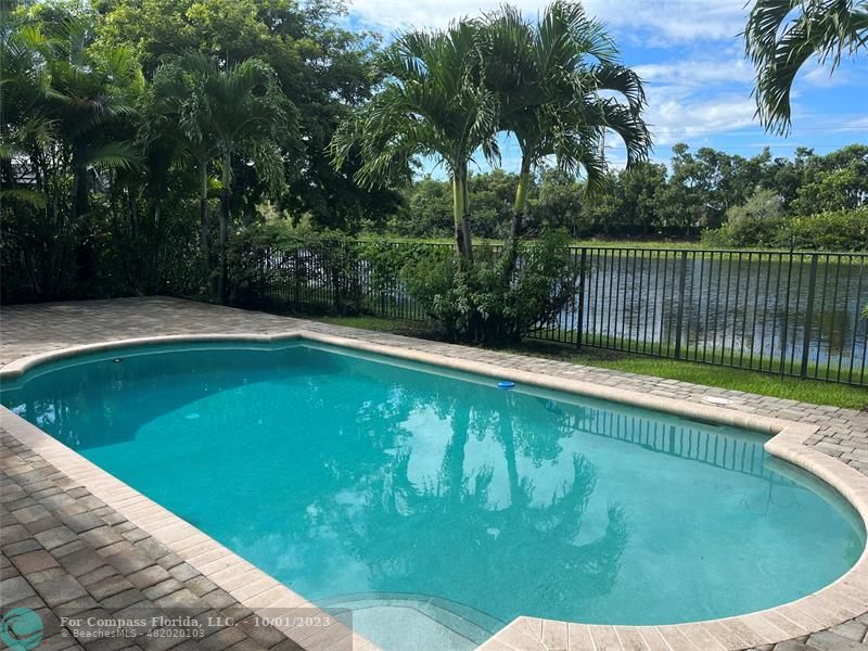 2993 Oakbrook Drive Weston, FL 33332 - Photo 10 of 11 a view of a swimming pool with a garden
