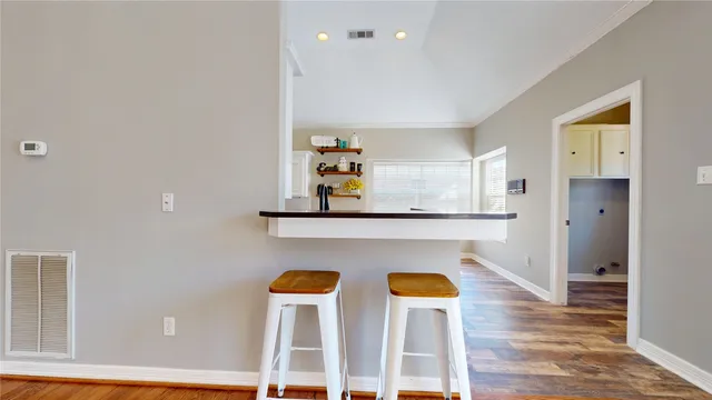 a view of kitchen with wooden floor and window