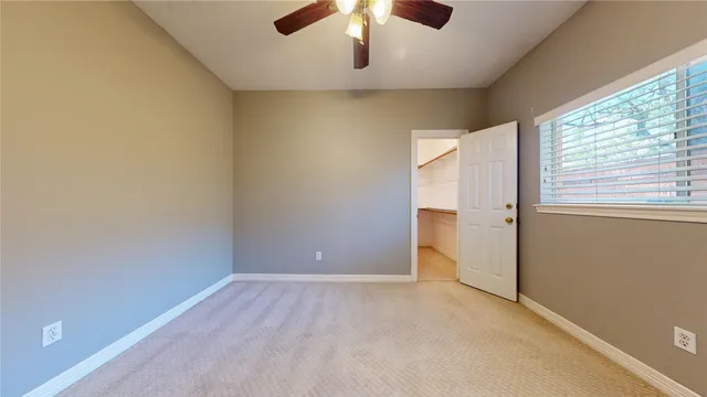 an empty room with a empty space and windows