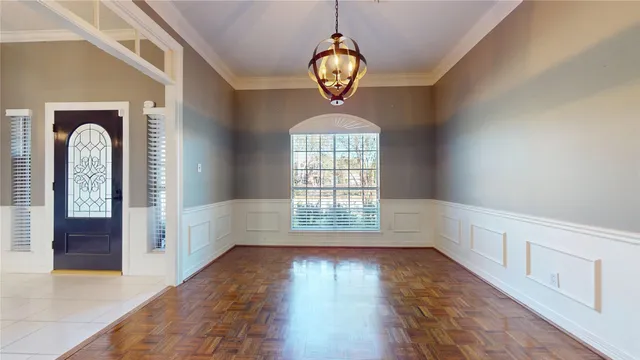 a view of an entryway with wooden floor