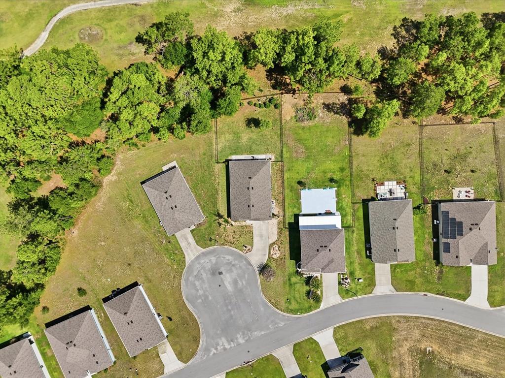 660 Hickory Course Loop Ocala, FL 34472 - Photo 43 of 45 an aerial view of a house with a swimming pool