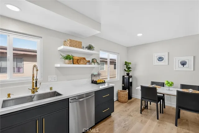 a kitchen with a sink and cabinets
