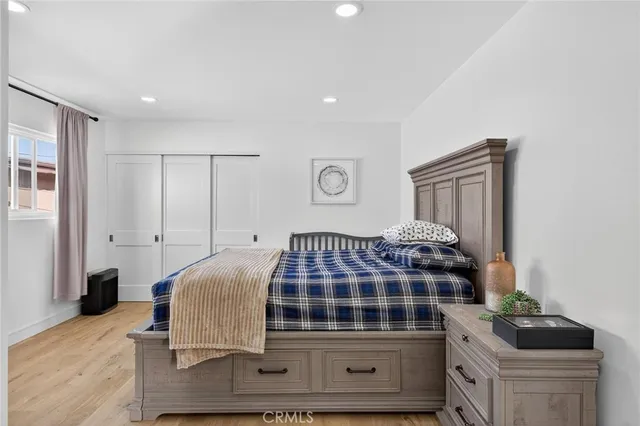 a bedroom with a bed and window