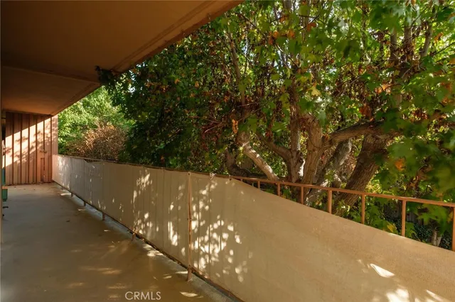 a house view with a sitting space and garden