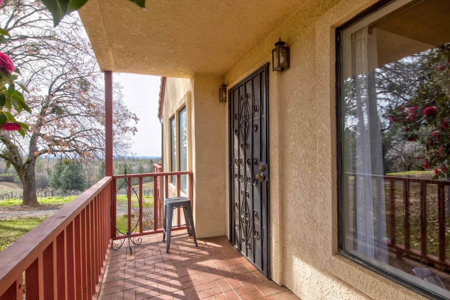4771 Greenhills Road Placerville, CA 95667 - Photo 11 of 71 a view of balcony with wooden floor and fence