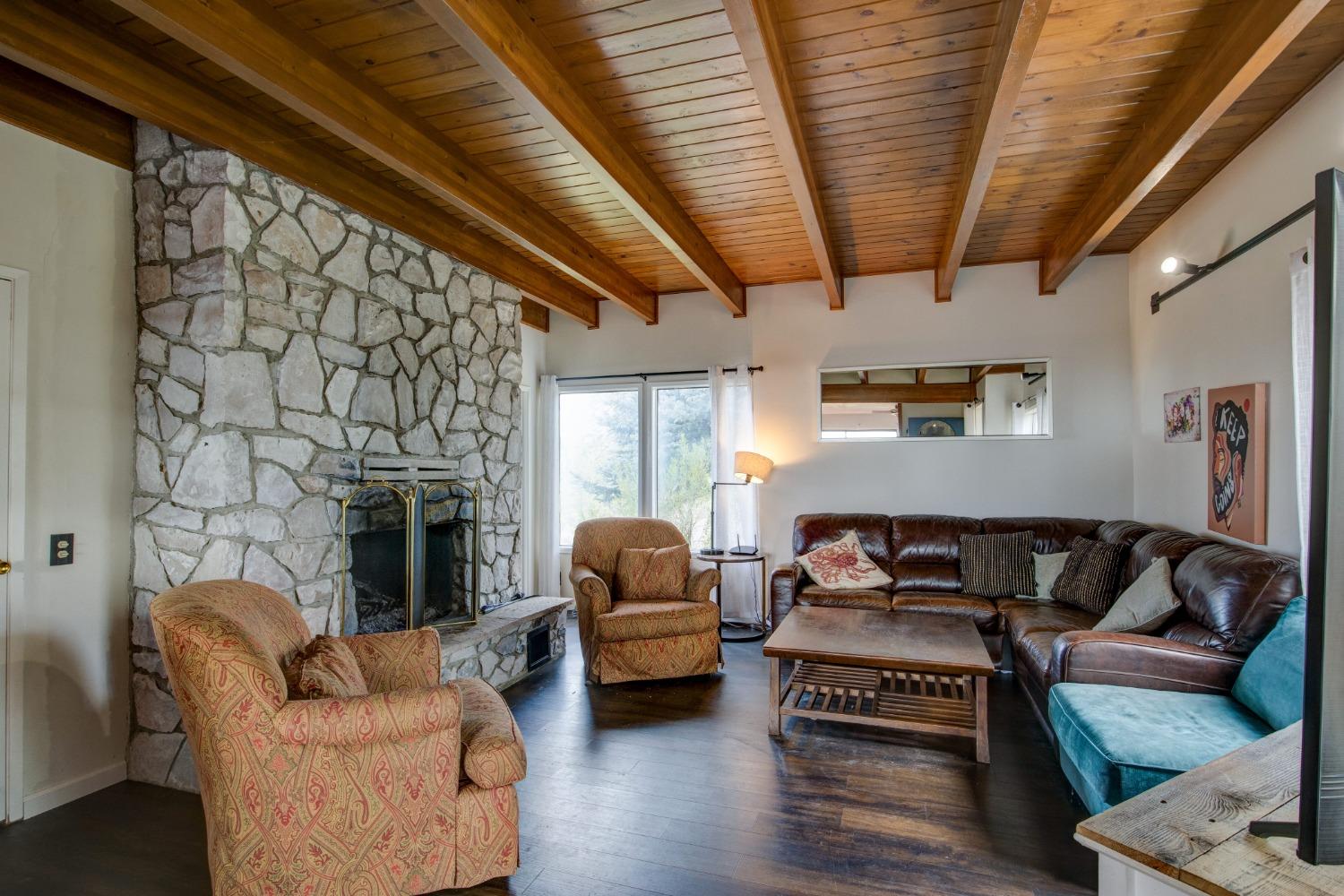 4771 Greenhills Road Placerville, CA 95667 - Photo 13 of 71 a living room with furniture and a fireplace