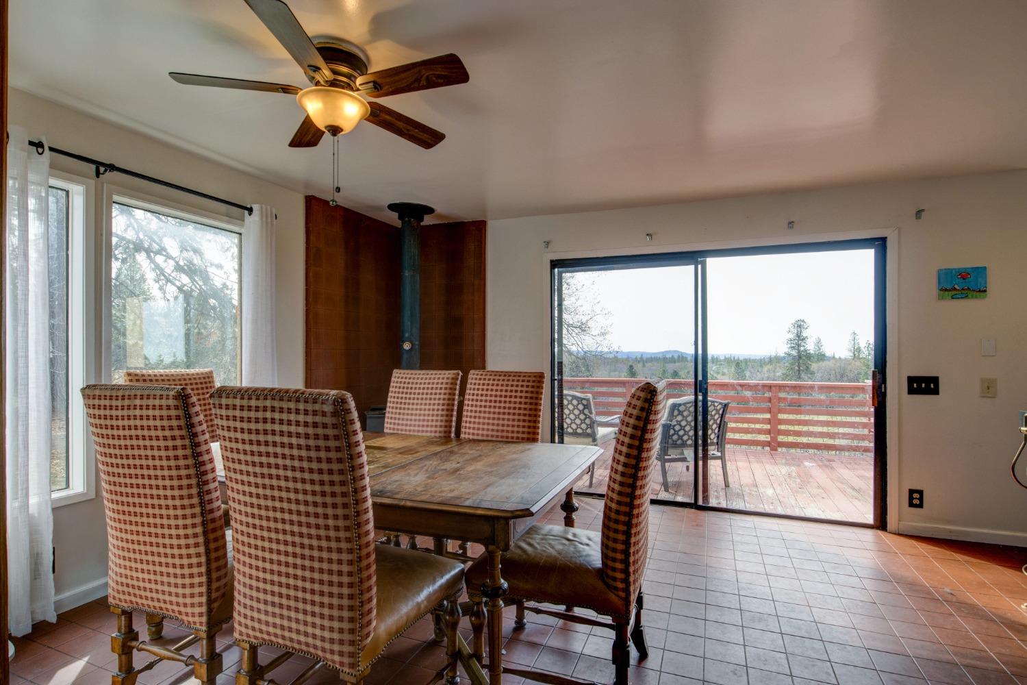 4771 Greenhills Road Placerville, CA 95667 - Photo 14 of 71 a view of a dining room with furniture window and outside view