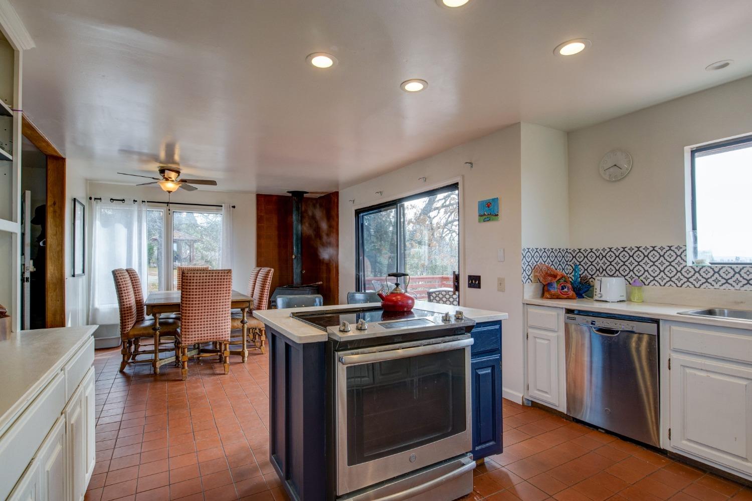 4771 Greenhills Road Placerville, CA 95667 - Photo 20 of 71 a kitchen that has a stove and a table