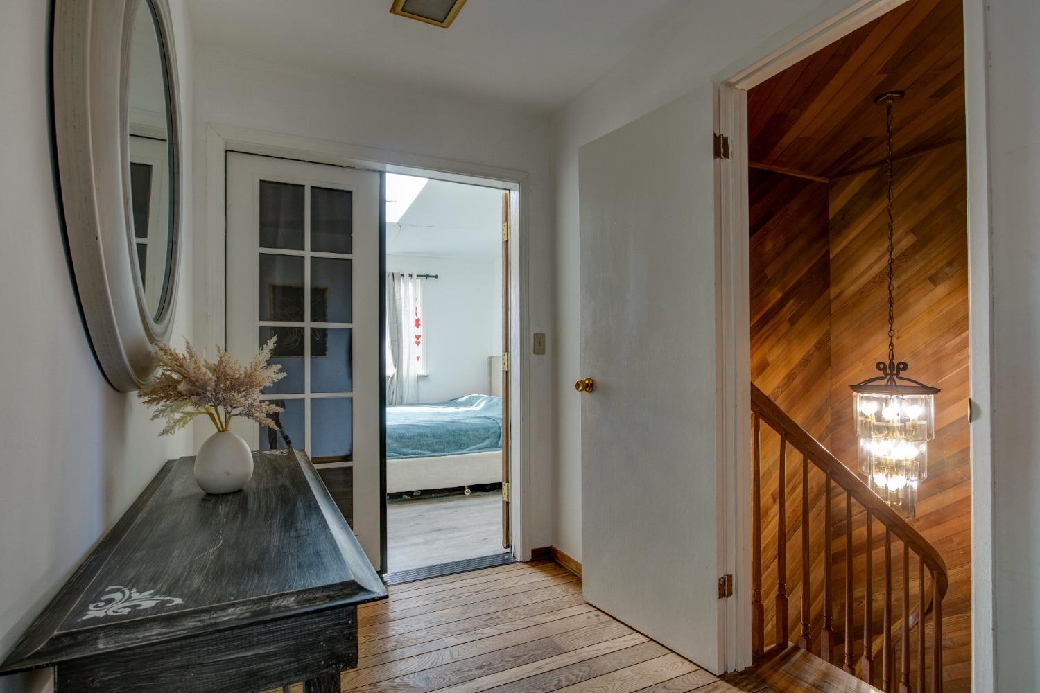 4771 Greenhills Road Placerville, CA 95667 - Photo 23 of 71 a view of a hallway with wooden floor and staircase
