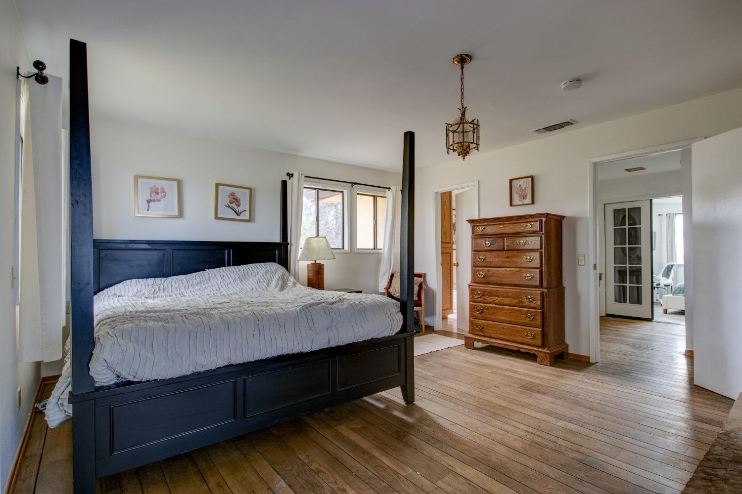 4771 Greenhills Road Placerville, CA 95667 - Photo 24 of 71 a bedroom with a bed and wooden floor