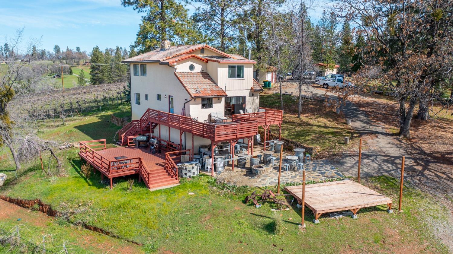 4771 Greenhills Road Placerville, CA 95667 - Photo 6 of 71 an aerial view of a house with swimming pool garden and patio