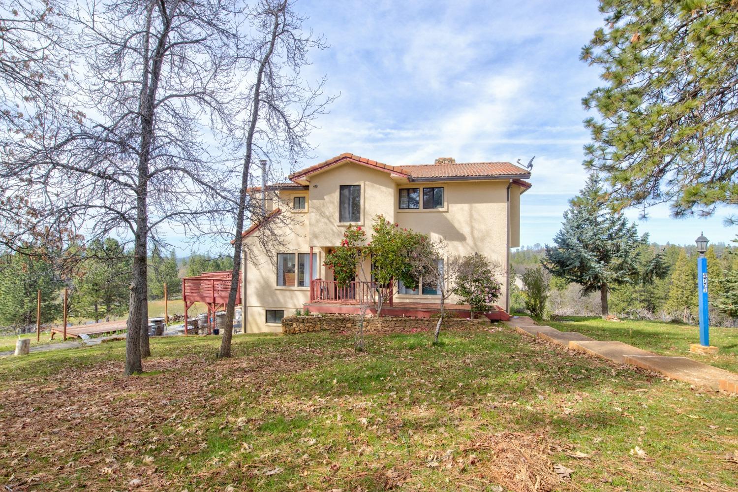 4771 Greenhills Road Placerville, CA 95667 - Photo 7 of 71 a front view of a house with a yard