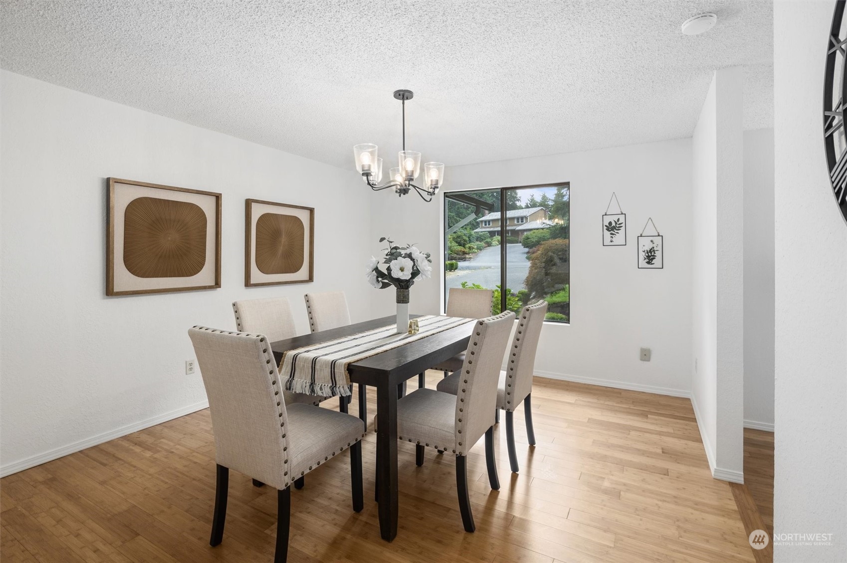 17631 7th Avenue West Bothell, WA 98012 - Photo 13 of 38 a view of a dining room with furniture window and wooden floor
