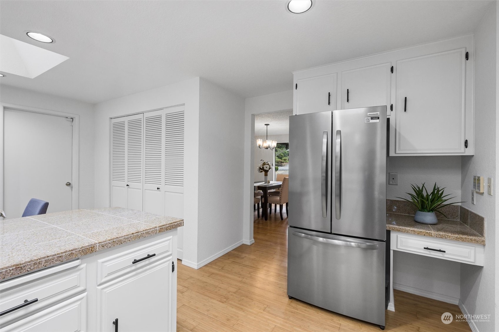 17631 7th Avenue West Bothell, WA 98012 - Photo 17 of 38 a kitchen with stainless steel appliances a refrigerator a sink a stove and white cabinets