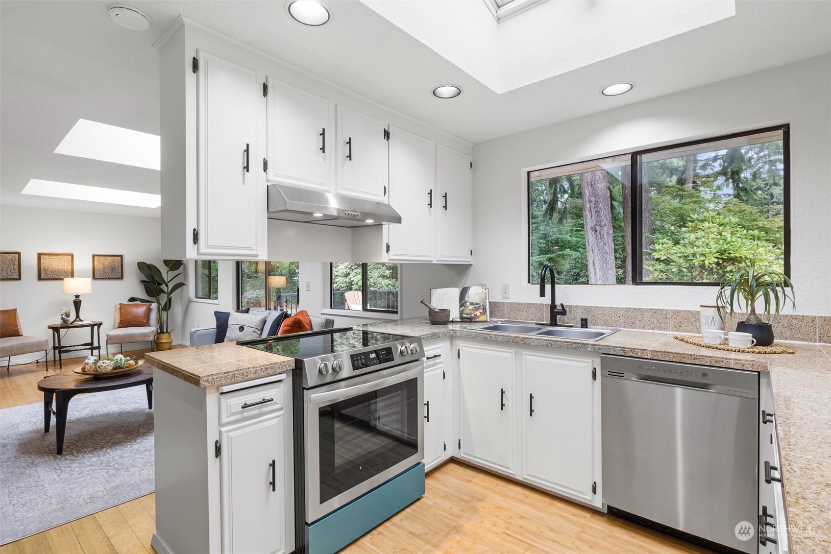 17631 7th Avenue West Bothell, WA 98012 - Photo 20 of 38 a kitchen with stainless steel appliances granite countertop a sink stove and cabinets