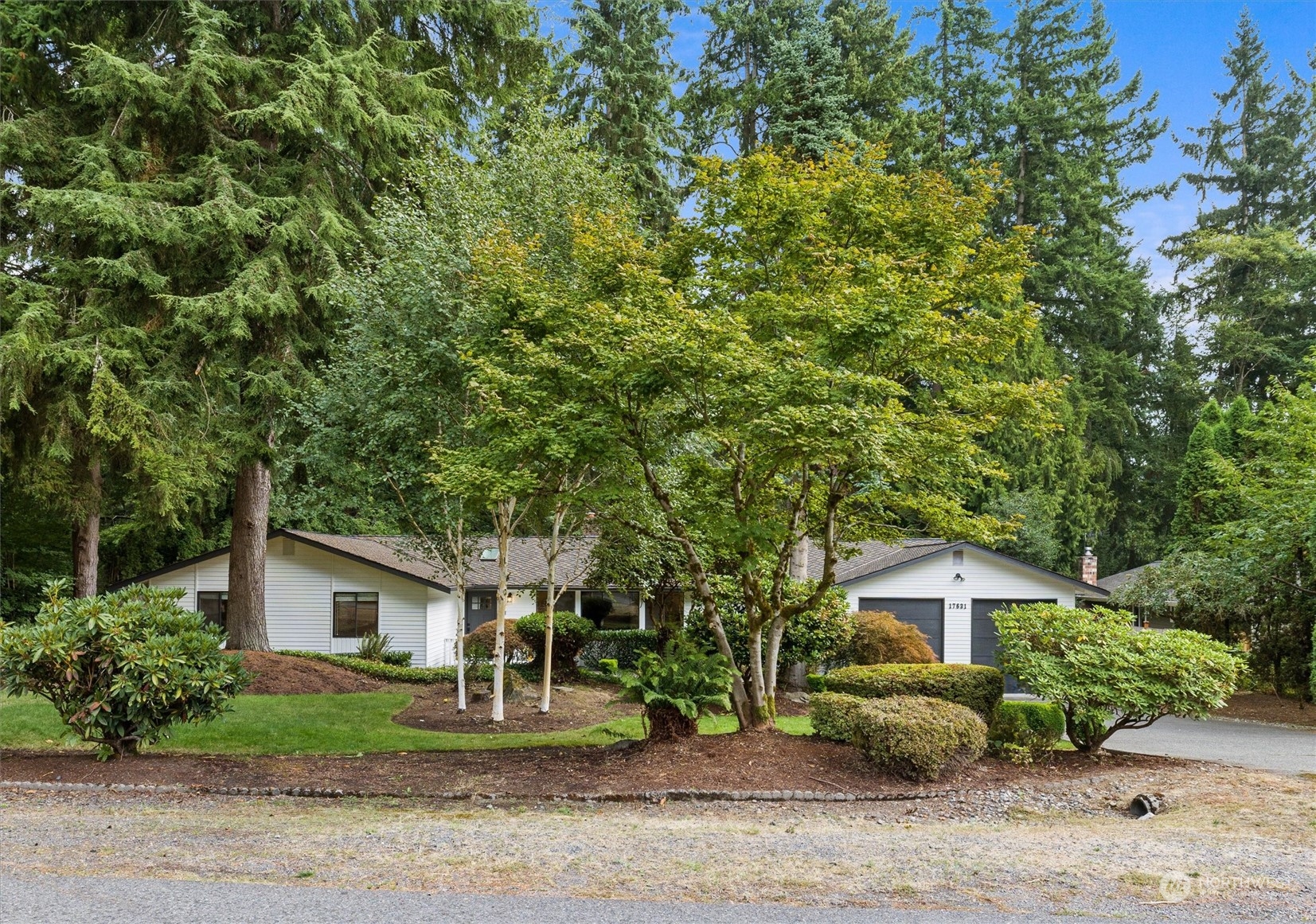 17631 7th Avenue West Bothell, WA 98012 - Photo 4 of 38 a front view of a house with a garden