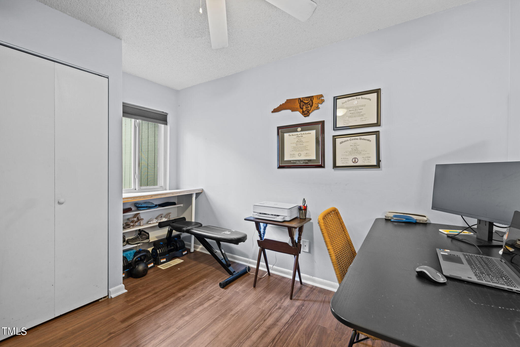 709 Godwin Court Raleigh, NC 27606 - Photo 20 of 31 a workspace with furniture and wooden floor