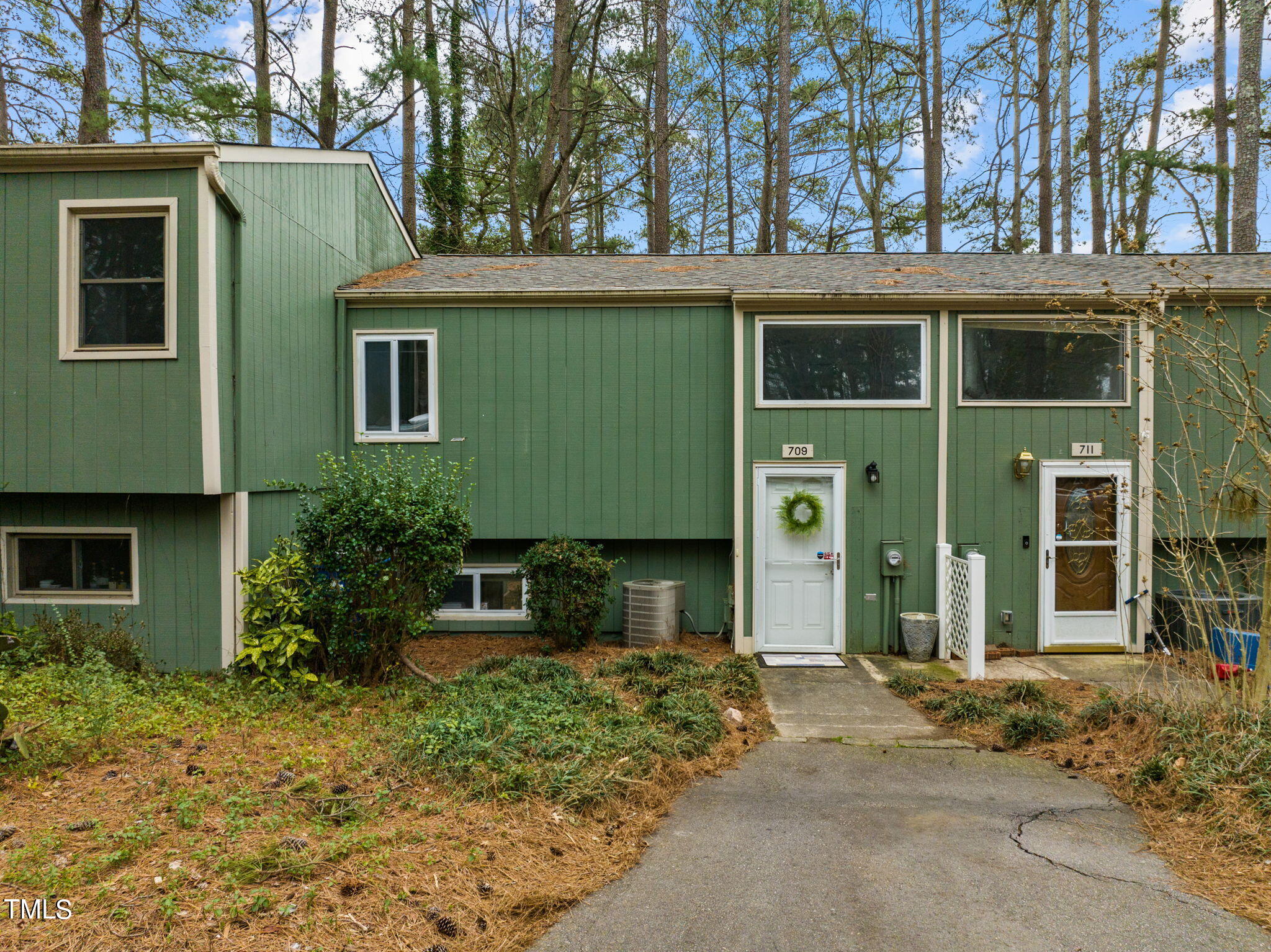 709 Godwin Court Raleigh, NC 27606 - Photo 2 of 31 a front view of a house with garden