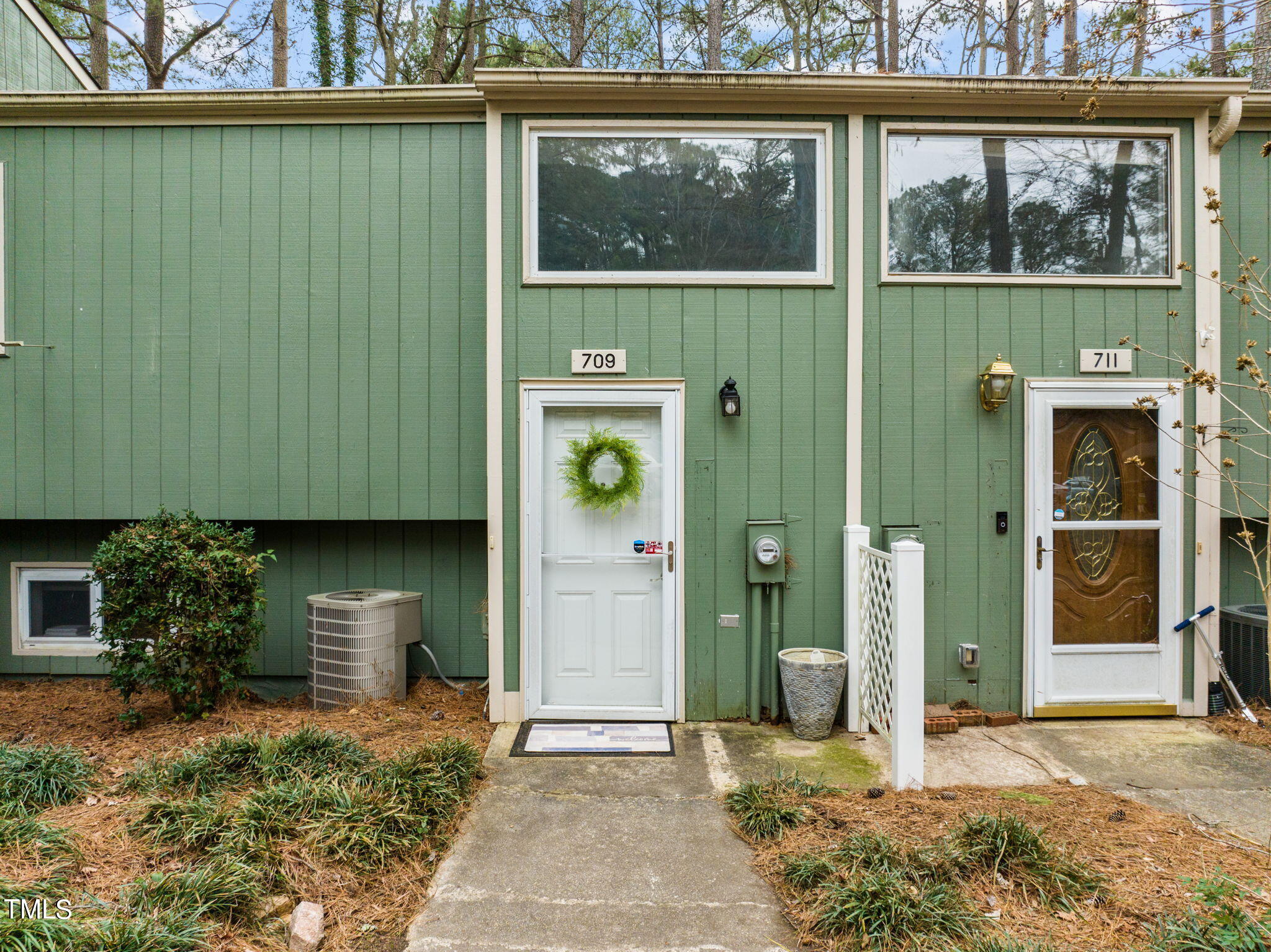 709 Godwin Court Raleigh, NC 27606 - Photo 3 of 31 a front view of a house with a garden