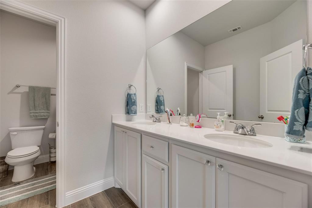 1271 Altuda Drive Forney, TX 75126 - Photo 14 of 35 a bathroom with a sink and a mirror