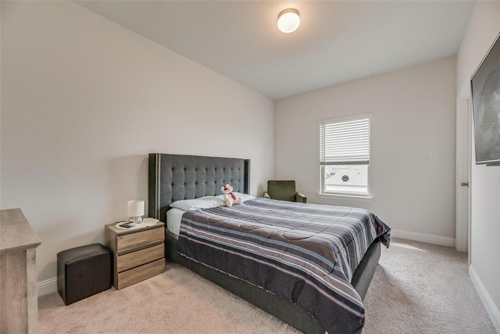 1271 Altuda Drive Forney, TX 75126 - Photo 15 of 35 a bedroom with a bed and a dresser