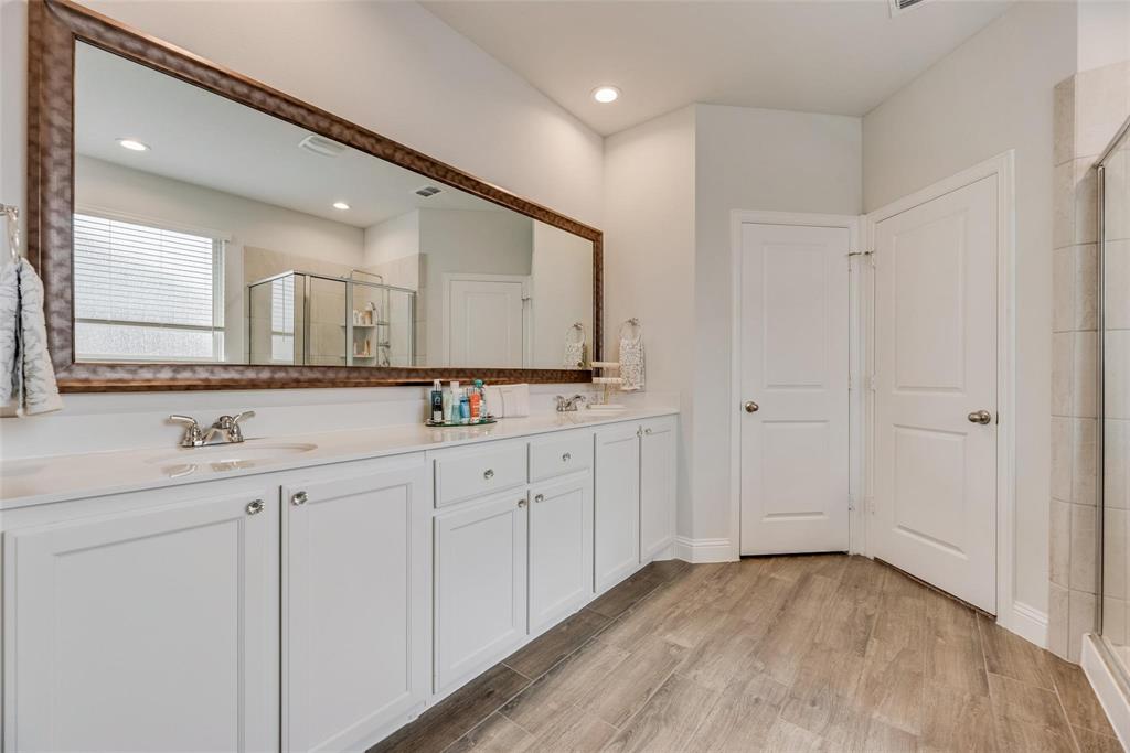 1271 Altuda Drive Forney, TX 75126 - Photo 20 of 35 a bathroom with a sink and a mirror