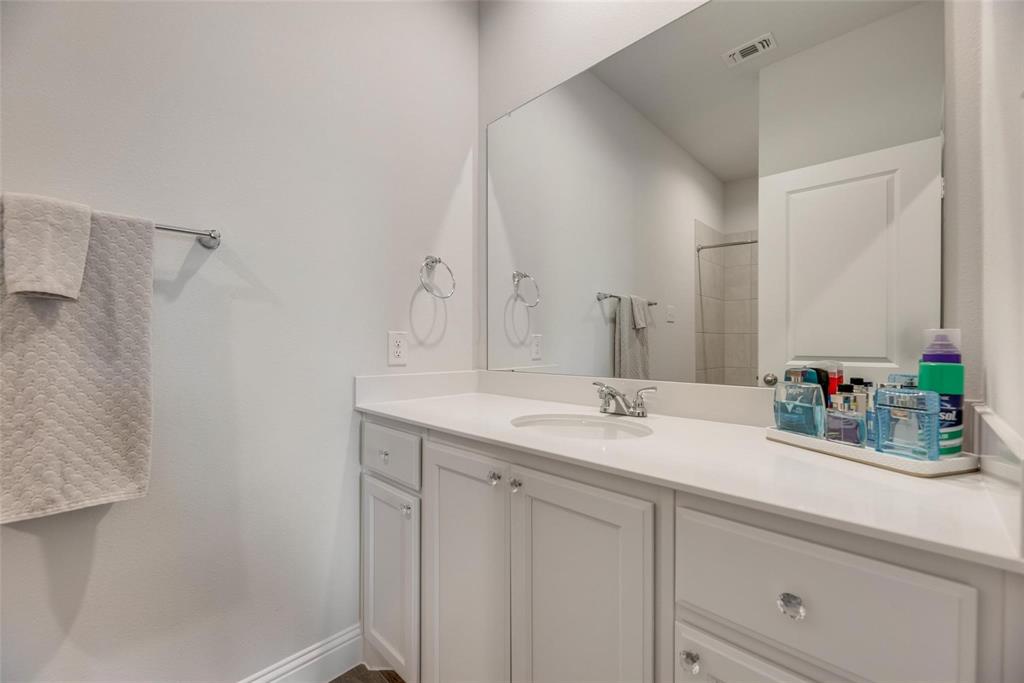 1271 Altuda Drive Forney, TX 75126 - Photo 24 of 35 a bathroom with a sink and a mirror