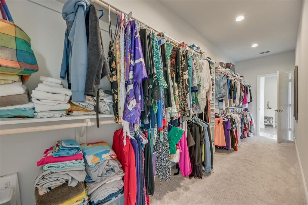 1271 Altuda Drive Forney, TX 75126 - Photo 27 of 35 a view of walk in closet with clothes