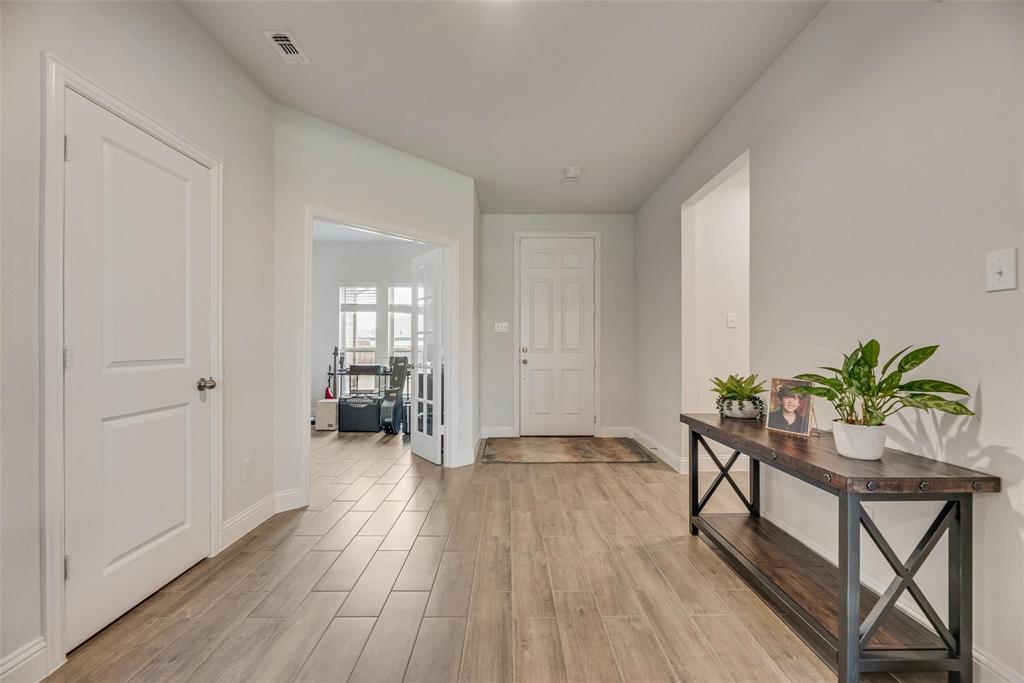 1271 Altuda Drive Forney, TX 75126 - Photo 6 of 35 a room with furniture and a wooden floor