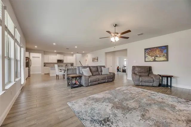 a living room with furniture and a table
