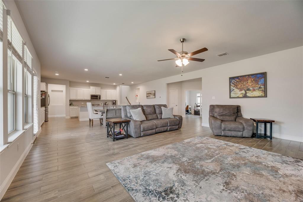 1271 Altuda Drive Forney, TX 75126 - Photo 7 of 35 a living room with furniture and a table