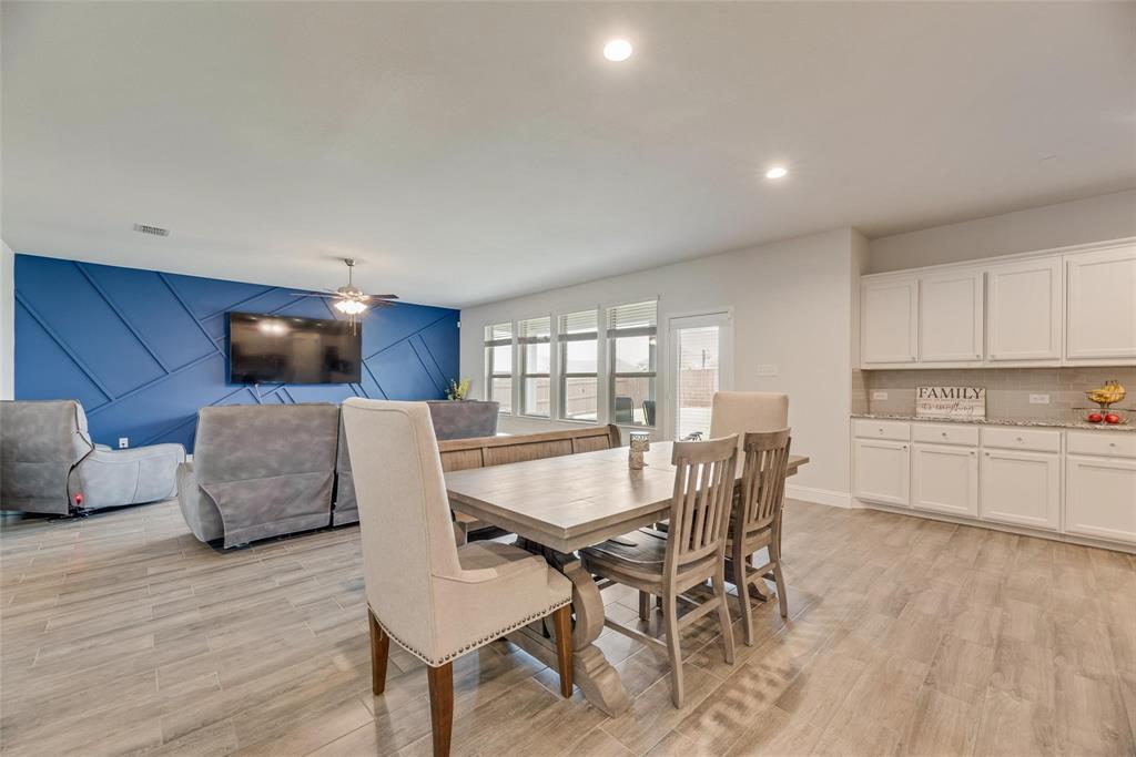 1271 Altuda Drive Forney, TX 75126 - Photo 9 of 35 a view of a dining room with furniture and wooden floor