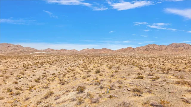 a view of mountain with a lake