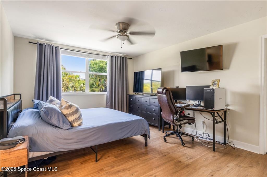 Undisclosed Address Vero Beach, FL 32966 - Photo 22 of 36 a bedroom with a bed a window and a flat screen television