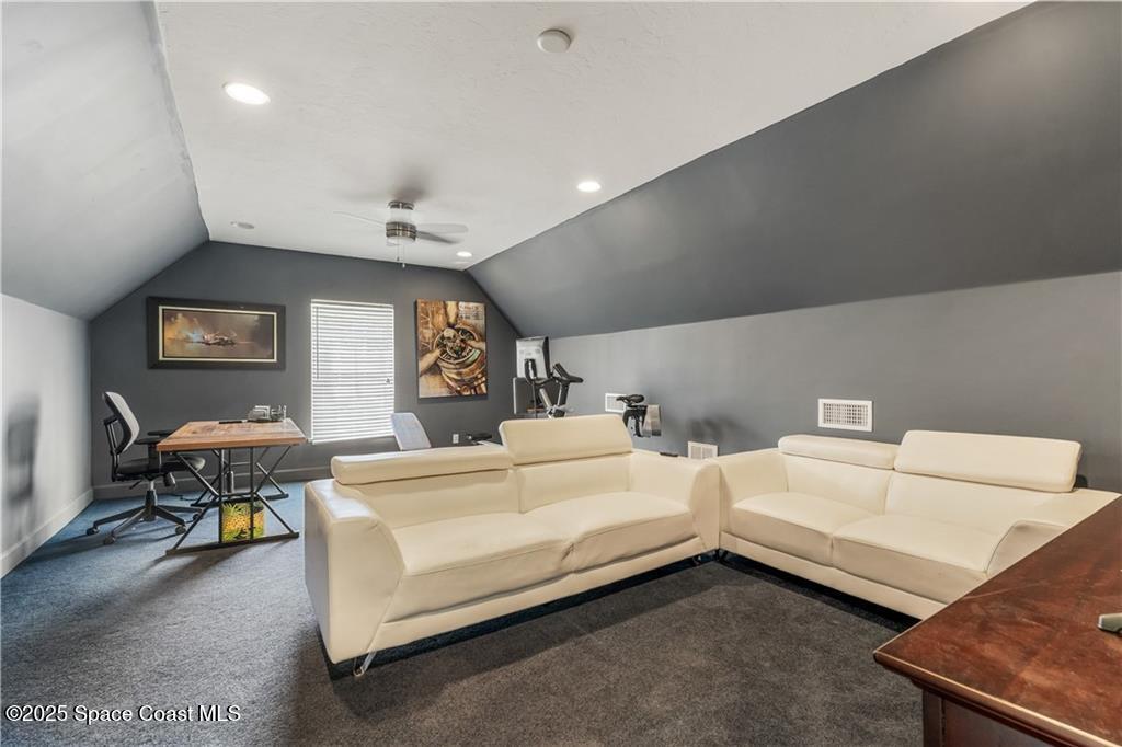 Undisclosed Address Vero Beach, FL 32966 - Photo 27 of 36 a spacious bedroom with two beds and a desk