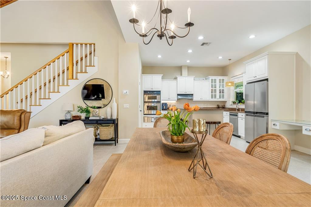 Undisclosed Address Vero Beach, FL 32966 - Photo 7 of 36 a living room with furniture appliances and kitchen view
