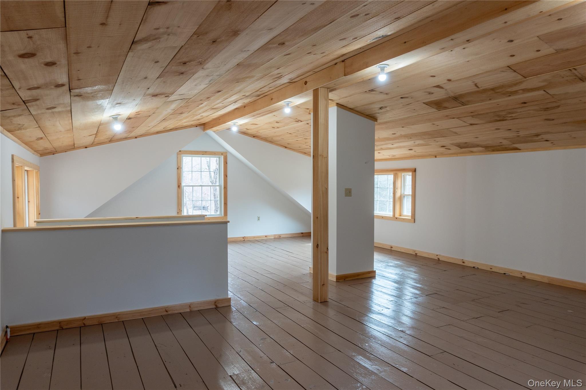 523 Shenandoah Road Hopewell Junction, NY 12533 - Photo 11 of 27 a view of an empty room with wooden floor and a window