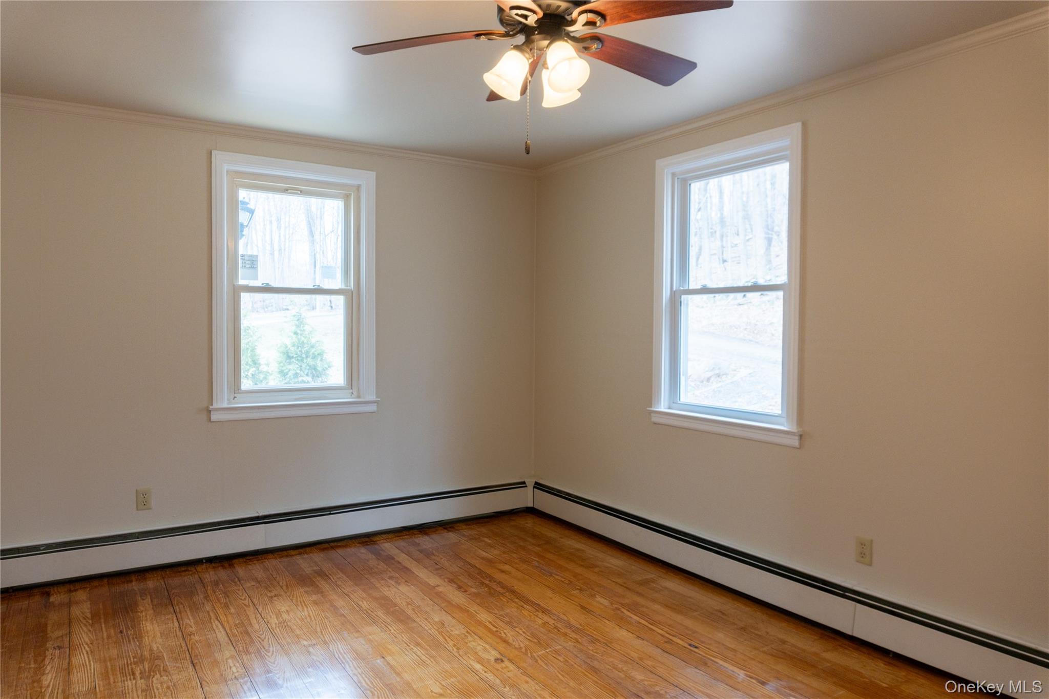 523 Shenandoah Road Hopewell Junction, NY 12533 - Photo 13 of 27 a view of an empty room with wooden floor and a window