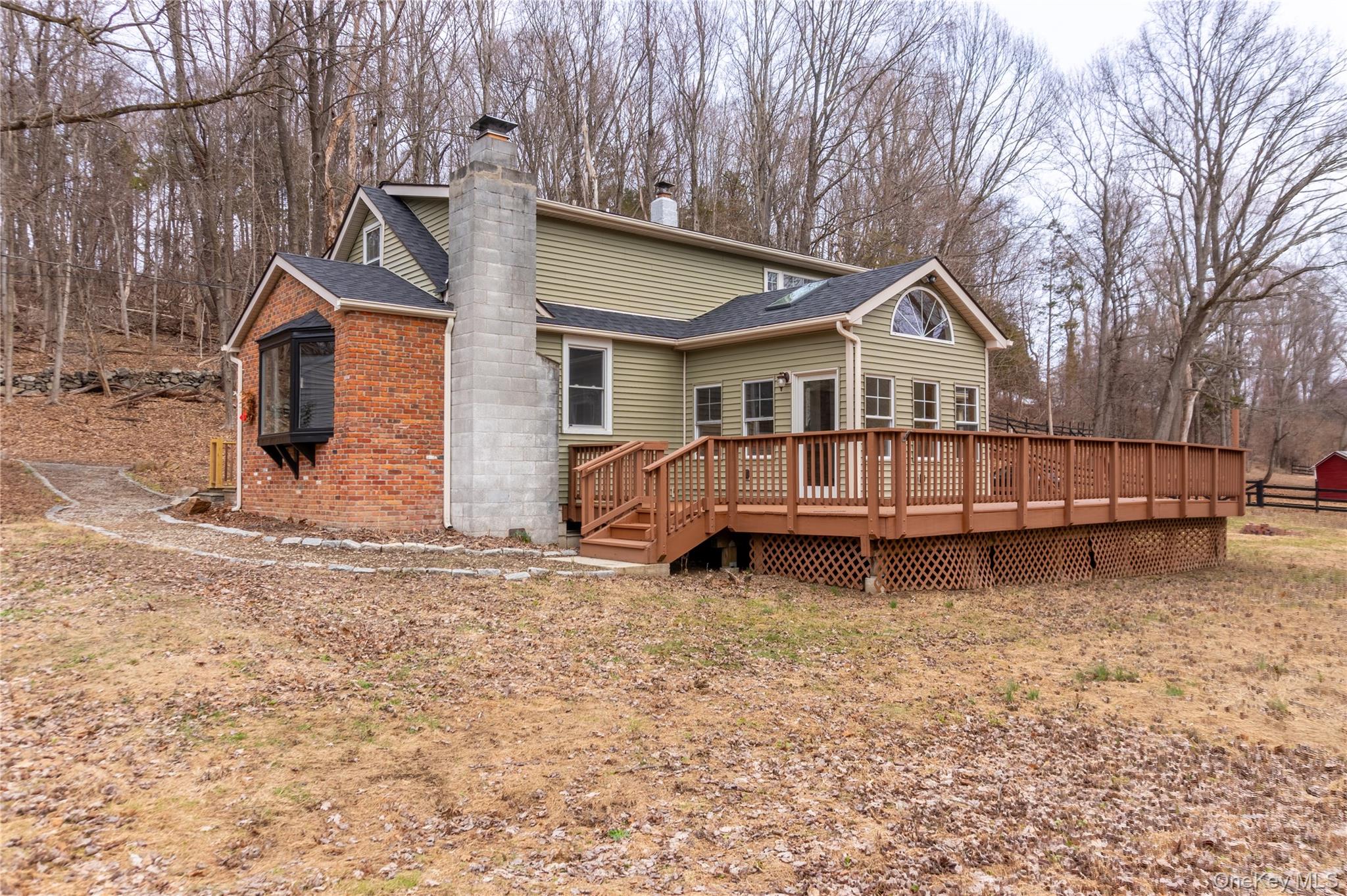 523 Shenandoah Road Hopewell Junction, NY 12533 - Photo 18 of 27 a view of a house with a yard and sitting area