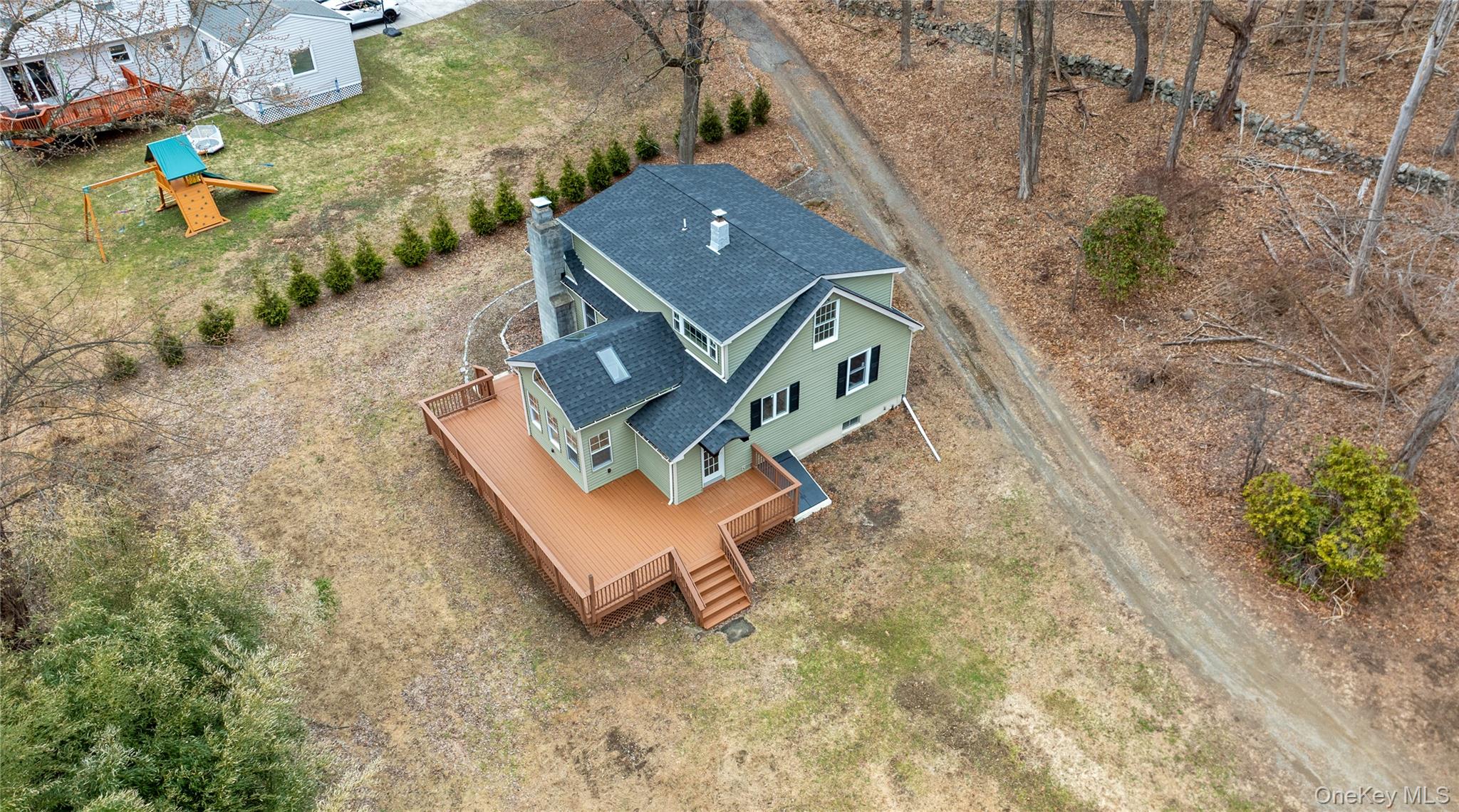 523 Shenandoah Road Hopewell Junction, NY 12533 - Photo 21 of 27 an aerial view of a house with a yard and trees