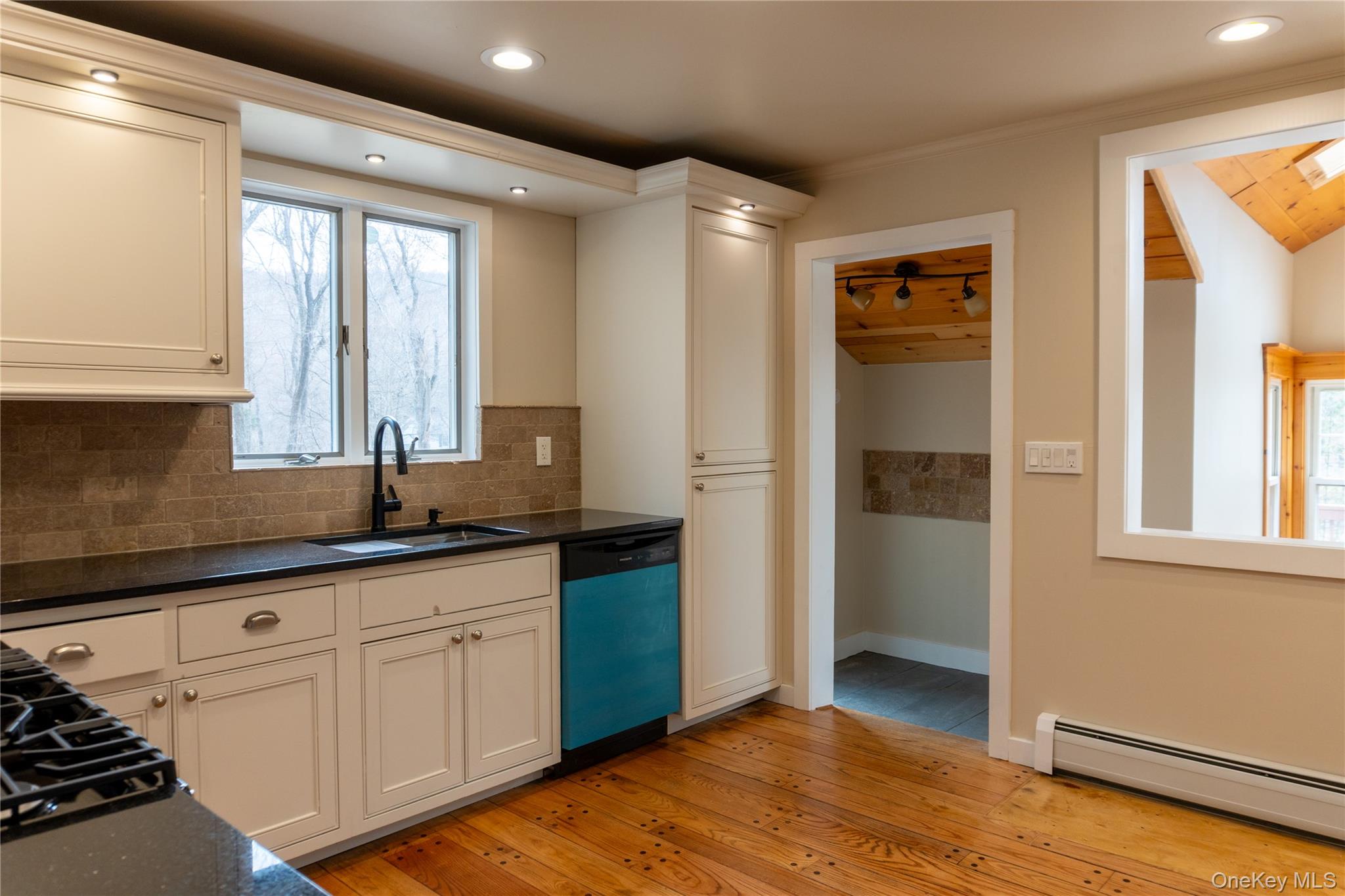 523 Shenandoah Road Hopewell Junction, NY 12533 - Photo 3 of 27 a kitchen with granite countertop a sink and a refrigerator
