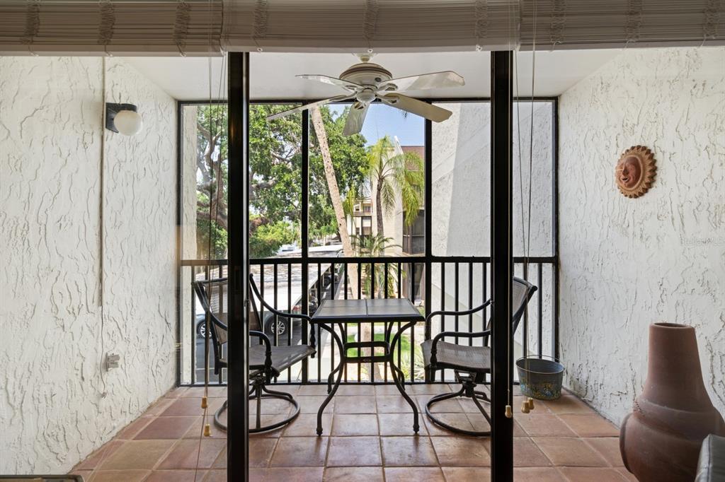 6157 Midnight Pass Road, Unit E22 Sarasota, FL 34242 - Photo 13 of 48 a view of entryway with wooden floor and windows