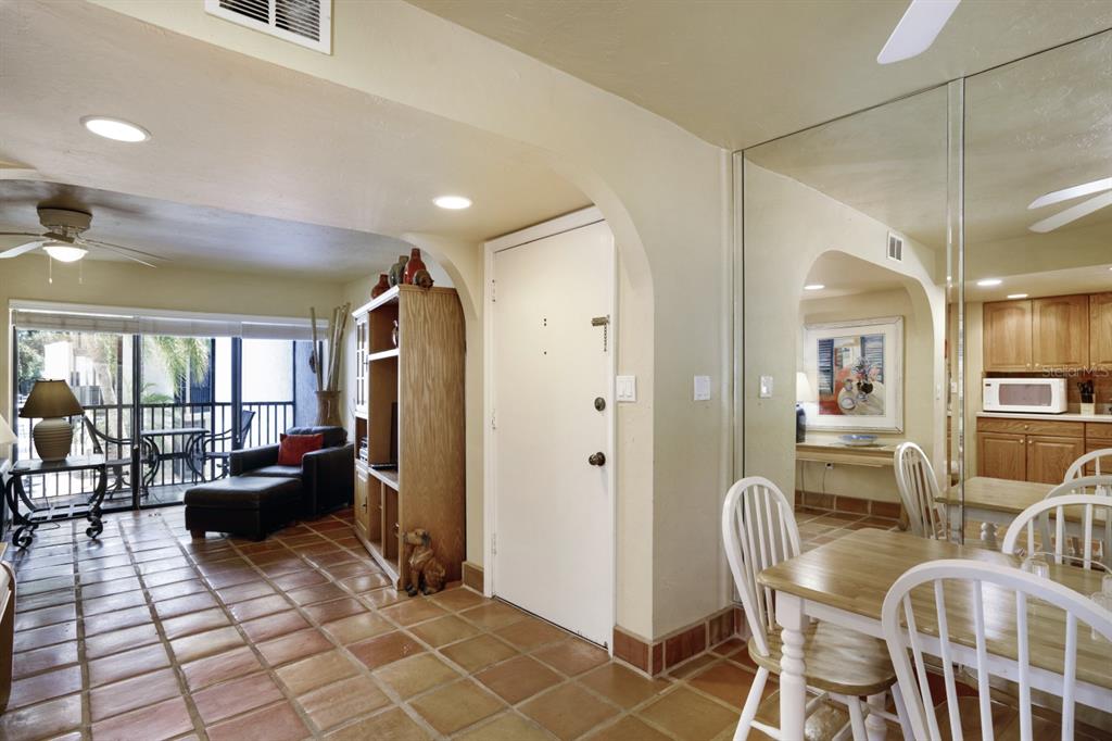 6157 Midnight Pass Road, Unit E22 Sarasota, FL 34242 - Photo 28 of 48 a living room with furniture and a fireplace