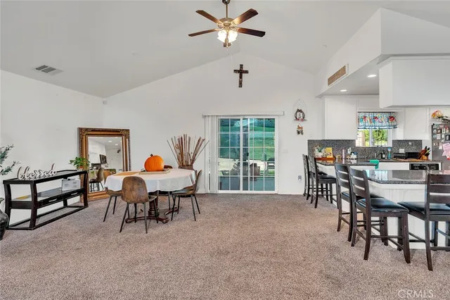 a dining room with furniture and window