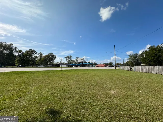 a view of an ocean and trees