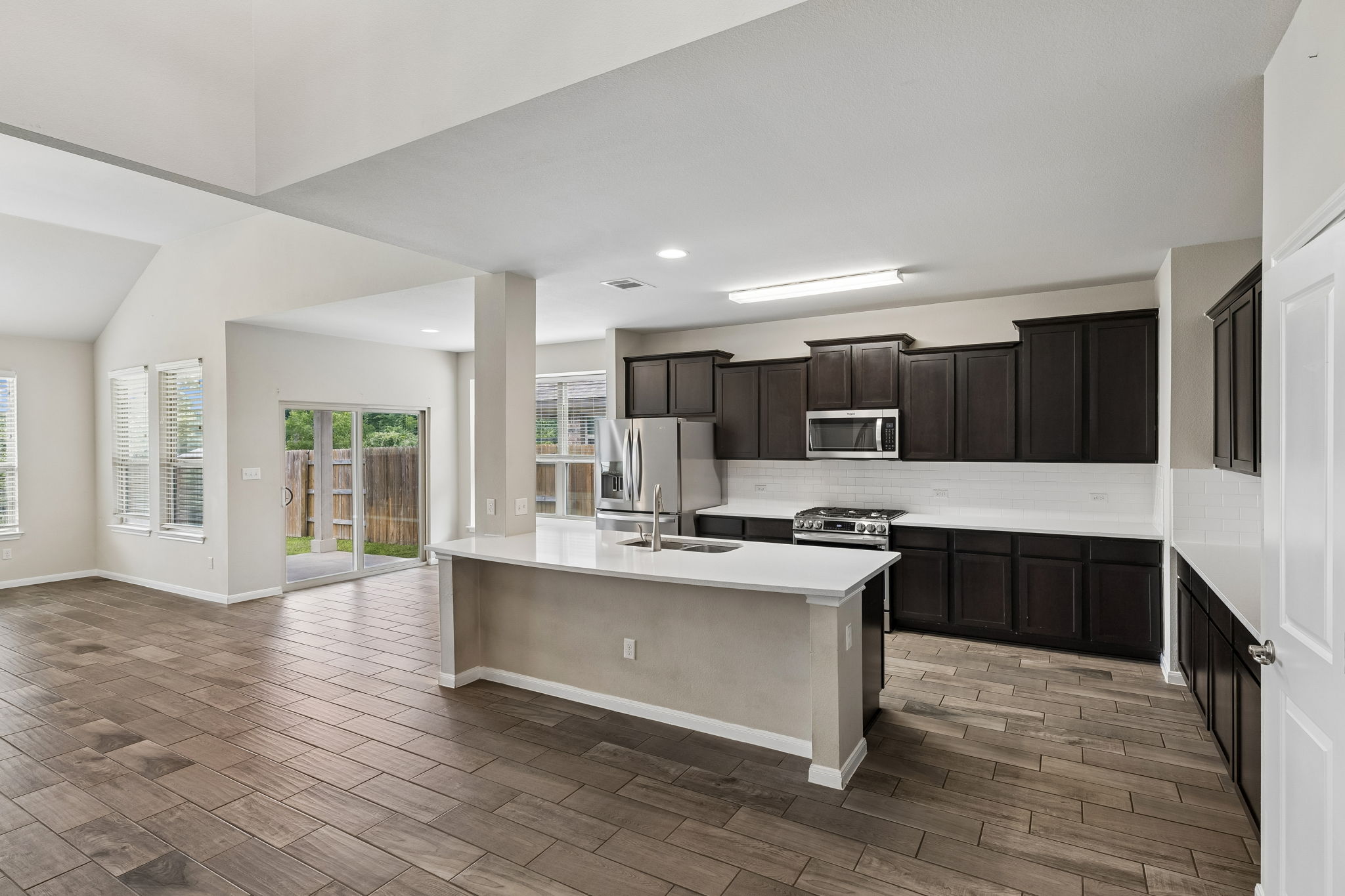 301 Rimrock Court Bastrop, TX 78602 - Photo 21 of 21 A spacious kitchen with an inviting island and an open floorplan, perfect for entertaining.