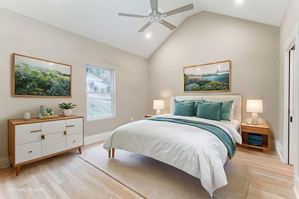 79 Logan Lane Ellijay, GA 30540 - Photo 11 of 56 a bedroom with a large bed and a window