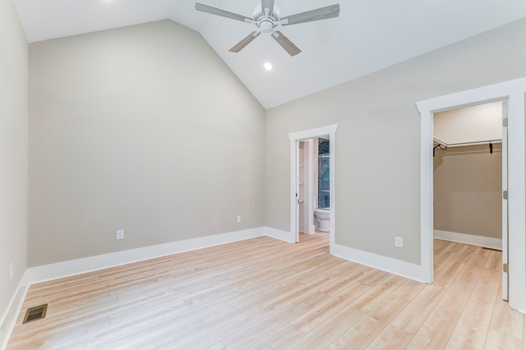 79 Logan Lane Ellijay, GA 30540 - Photo 12 of 56 an empty room with wooden floor and ceiling fan