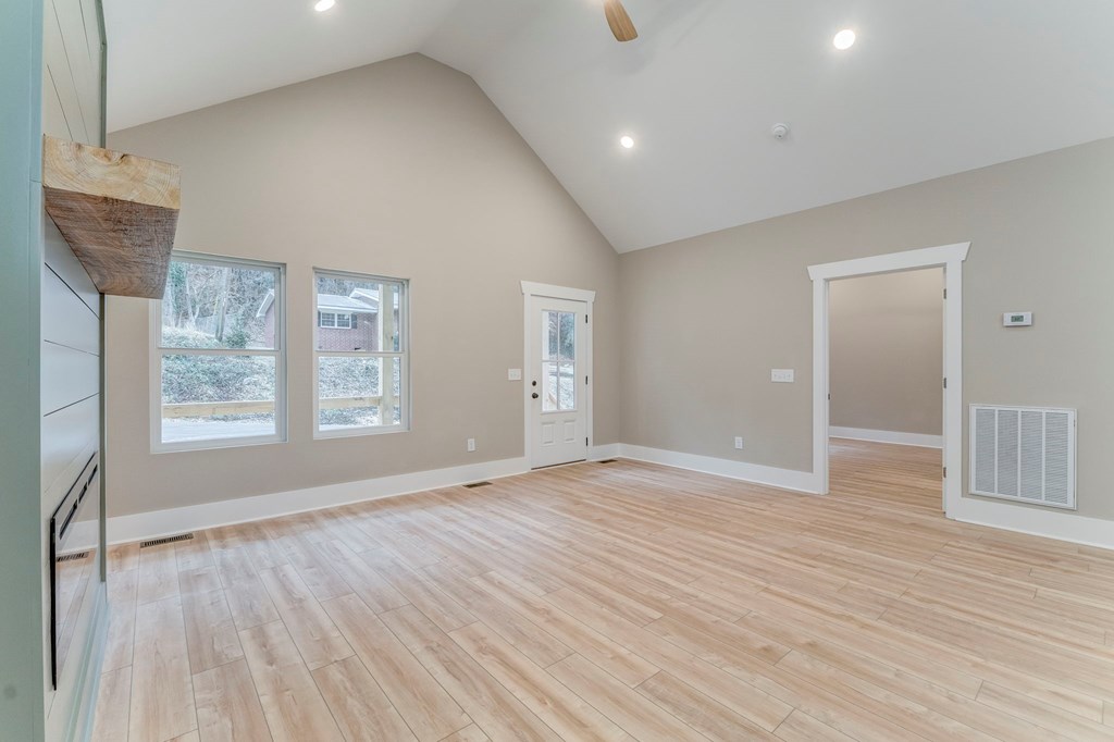 79 Logan Lane Ellijay, GA 30540 - Photo 25 of 56 an empty room with wooden floor and windows